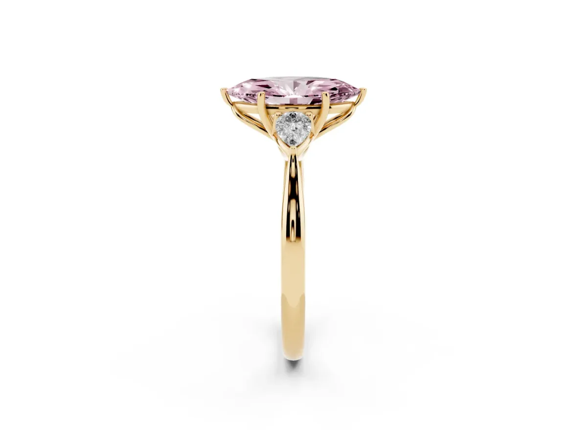 Fancy Pink Three-Stone Marquise Cut Diamond Ring with Pear Side Stones in Four-Prong Setting Yellow gold