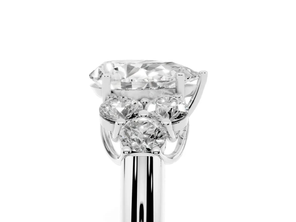 Pear Cut Cut Diamond Cluster Ring with Round Accent Stones and Prong Setting on a Classic Band White gold