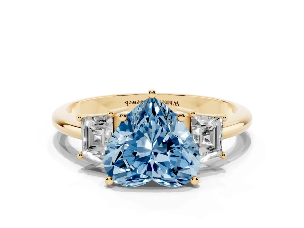 Fancy Blue Heart Cut Diamond Three-Stone Ring with Trapezoid Side Stones and Prong Setting Yellow gold
