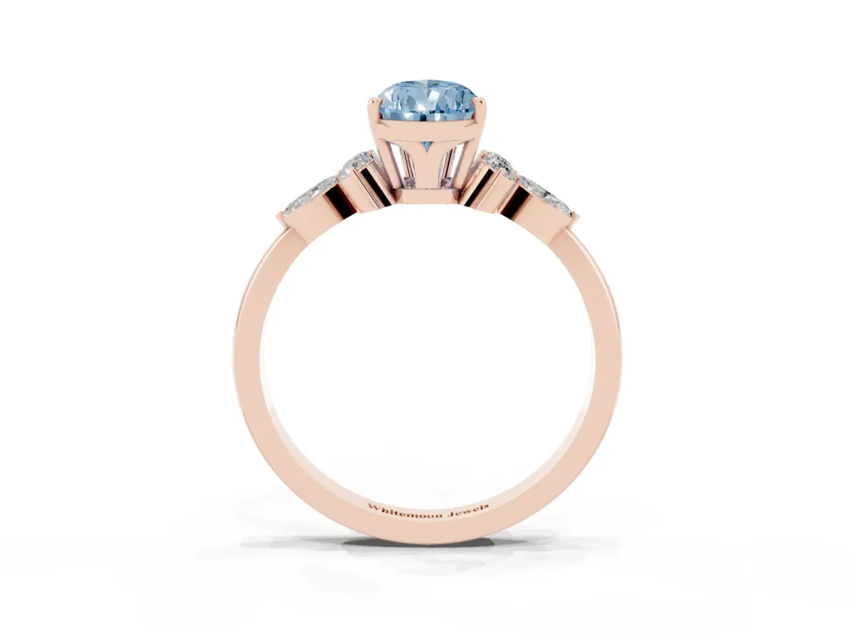 Fancy Blue Pear Cut Brilliant Diamond Solitaire Ring with Pear Side Stones and Four-Prong Setting Rose gold