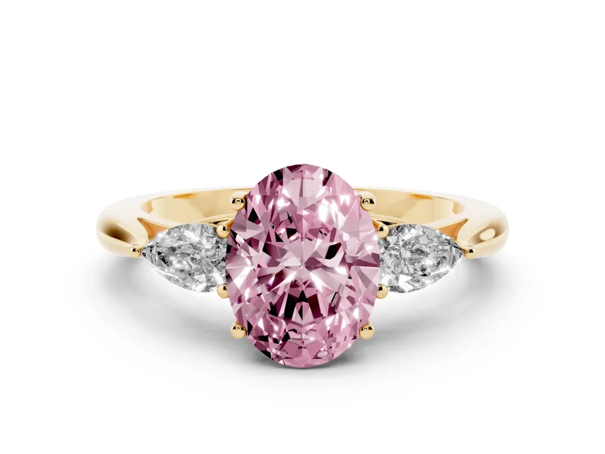 Fancy Pink Three-Stone Oval Cut Diamond Ring with Pear Side Stones in Four-Prong Setting Yellow gold