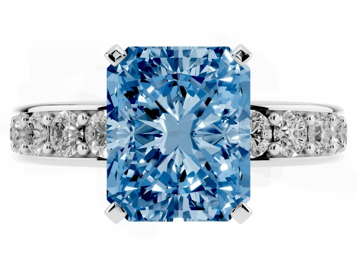 Fancy Blue Radiant Cut Diamond Engagement Ring with Channel Set Round Band and Prong Setting Silver