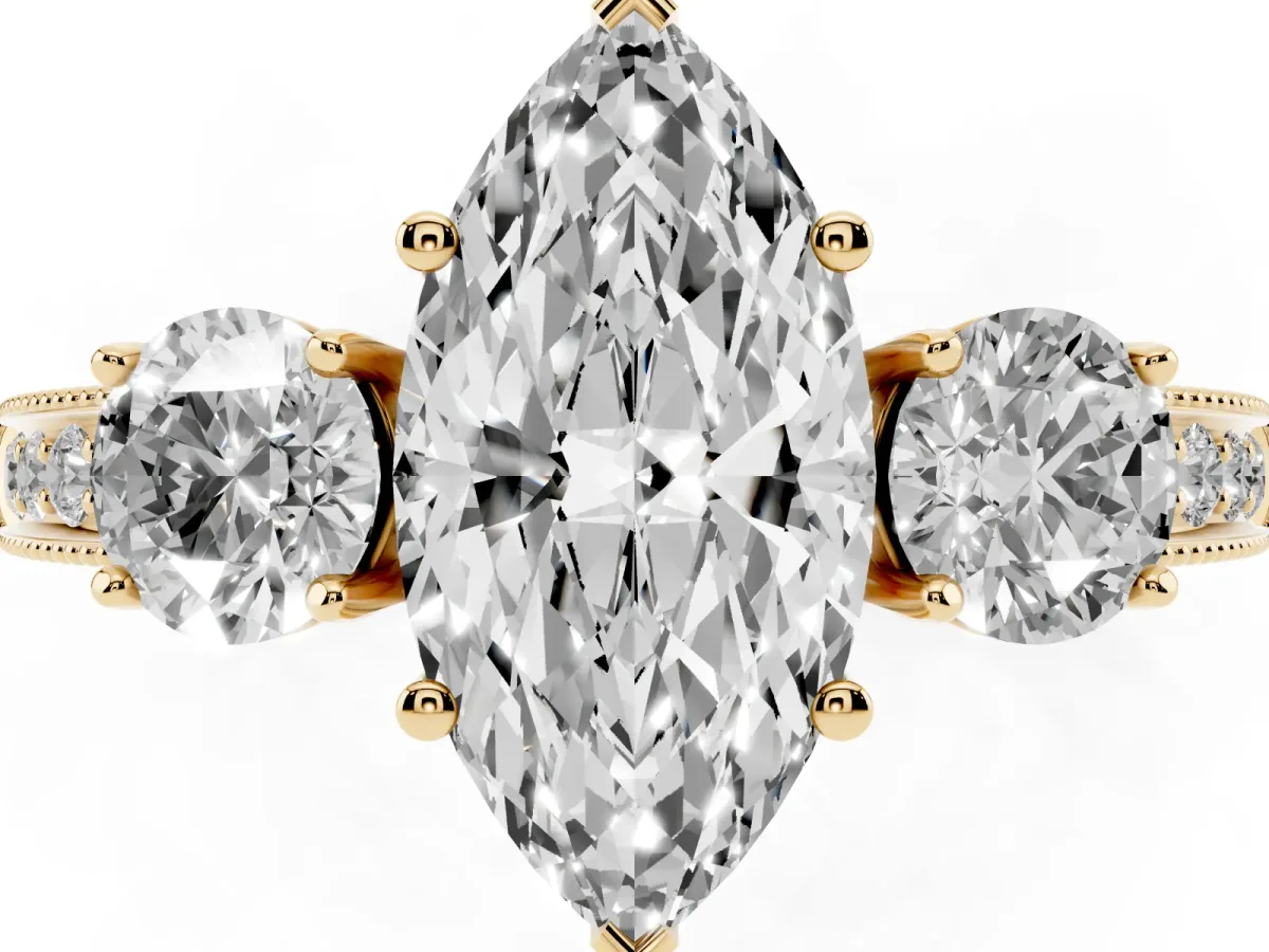 Marquise Cut Three-Stone Diamond Ring with Pavé Band and Four-Prong Setting Yellow gold