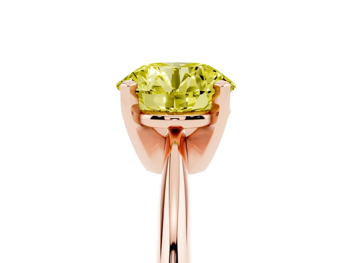 Fancy Yellow Round Cut Cut Solitaire Ring with Four-Prong Setting on a Classic Band Rose gold