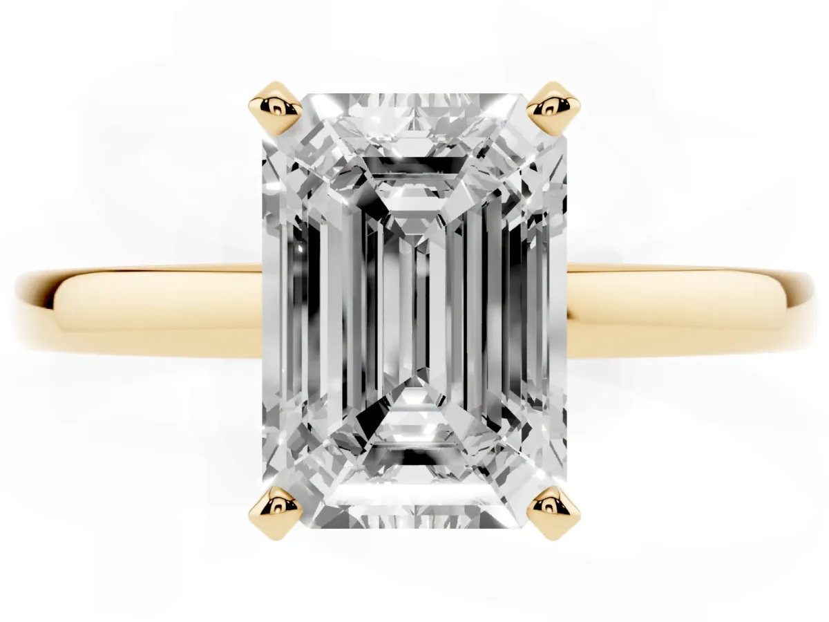 Emerald Cut Solitaire Diamond Engagement Ring with Four-Prong Setting on a Classic Band Yellow gold