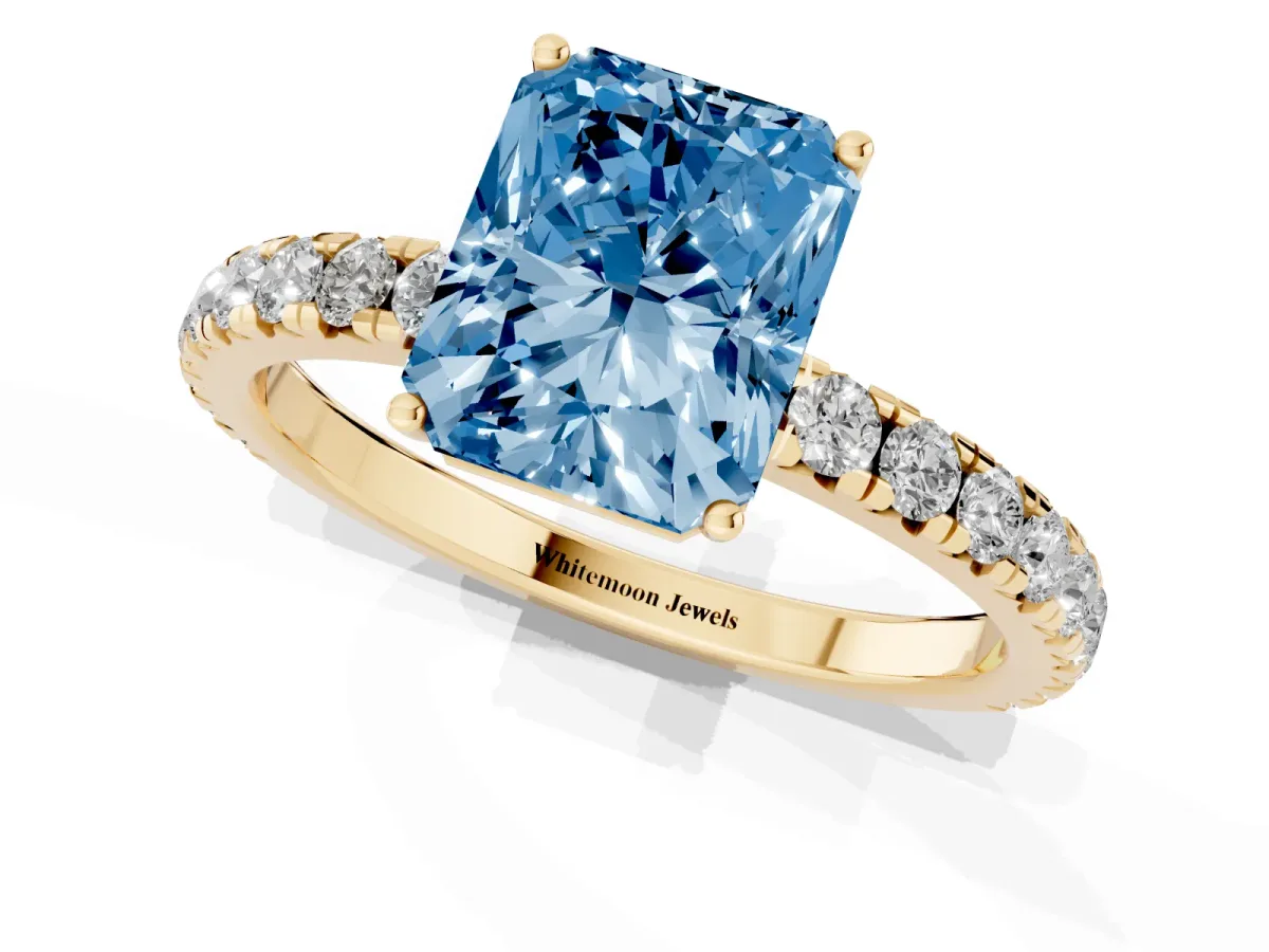 Fancy Blue Radiant Cut Diamond Pavé Solitaire Engagement Ring with Four-Prong Setting Yellow gold