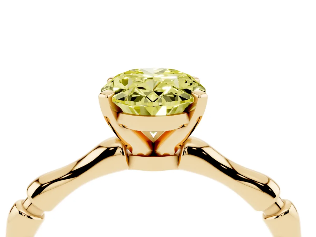 Fancy Yellow Oval Cut Solitaire Diamond Ring with Bamboo Band and Four-Prong Setting Yellow gold