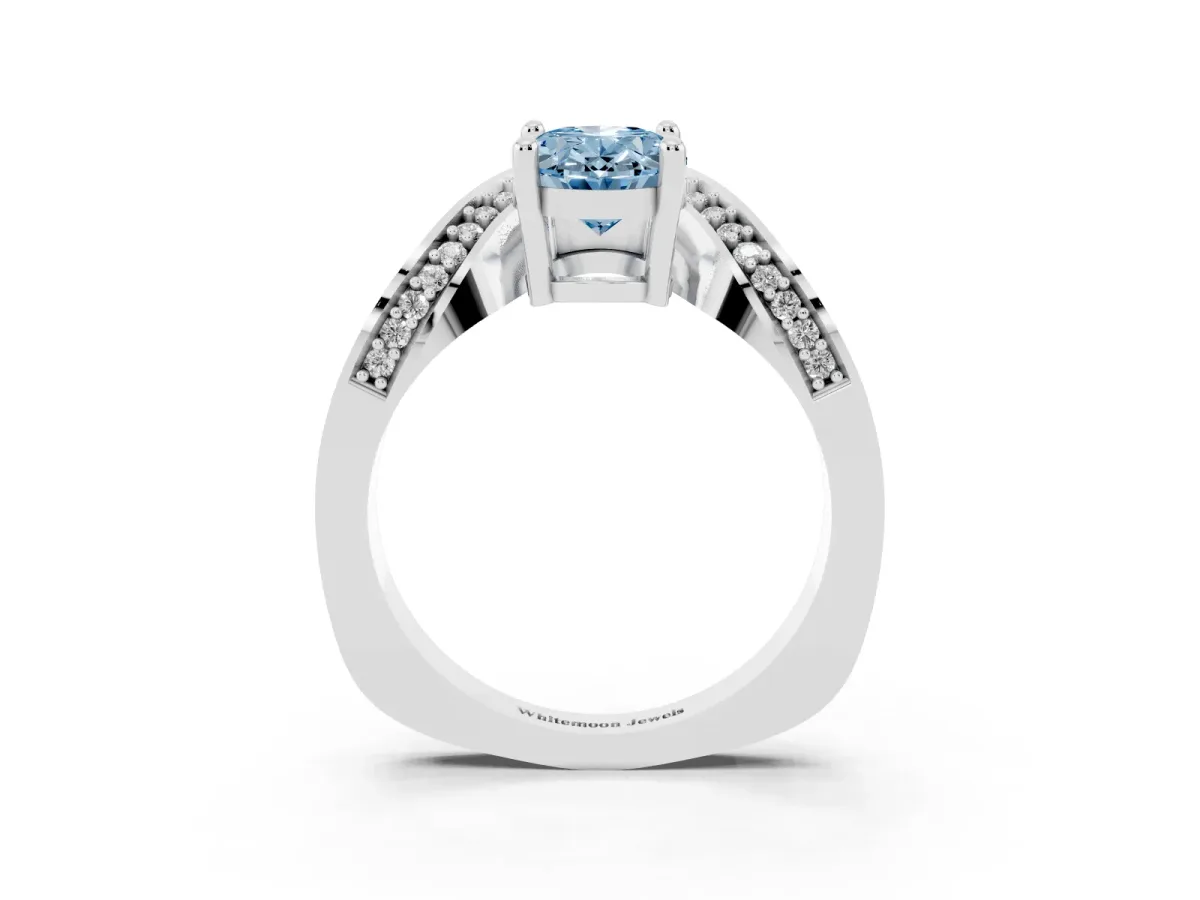 Fancy Blue Oval Cut Solitaire Diamond Engagement Ring with Pave Band and Four-Prong Setting Silver