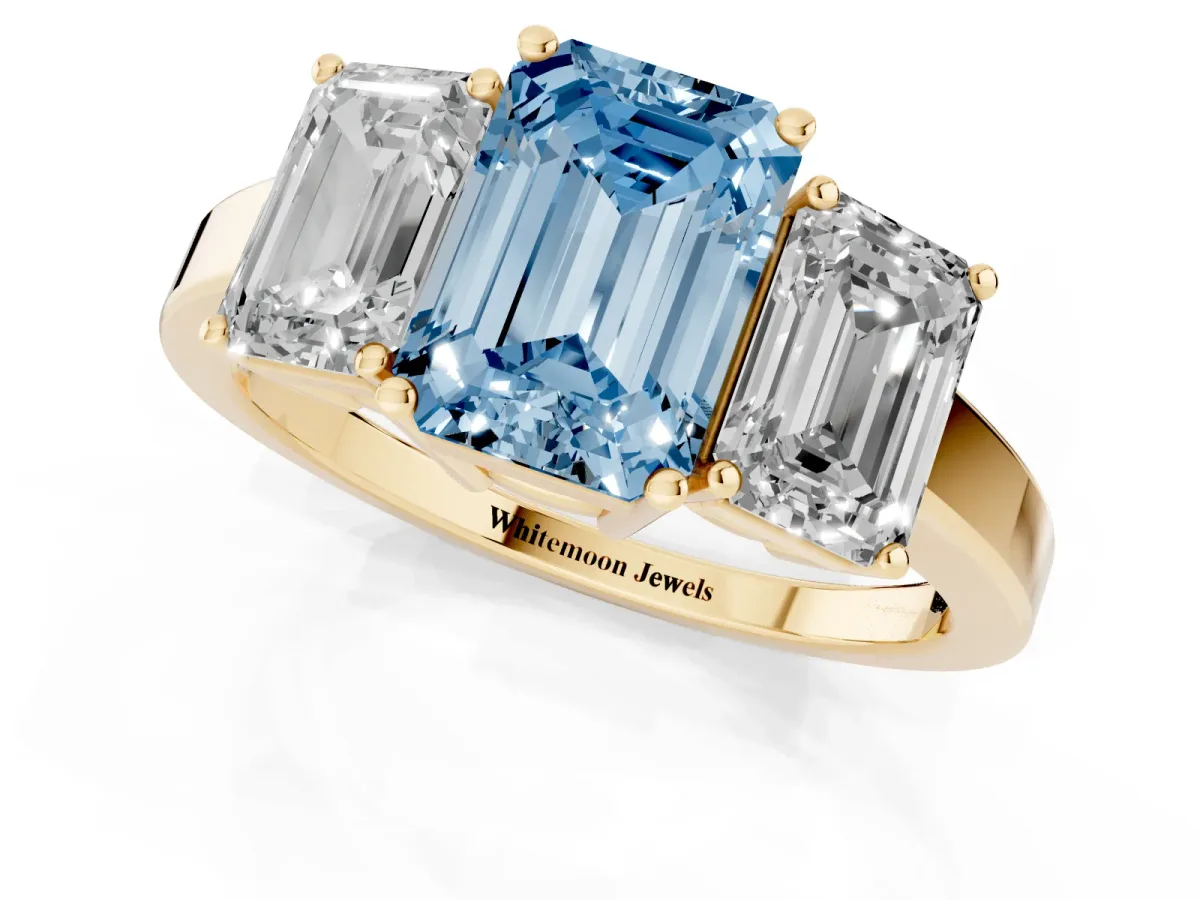 Fancy Blue Three-Stone Emerald Cut Cut Diamond Engagement Ring with Flat Band and Four-Prong Setting Yellow gold