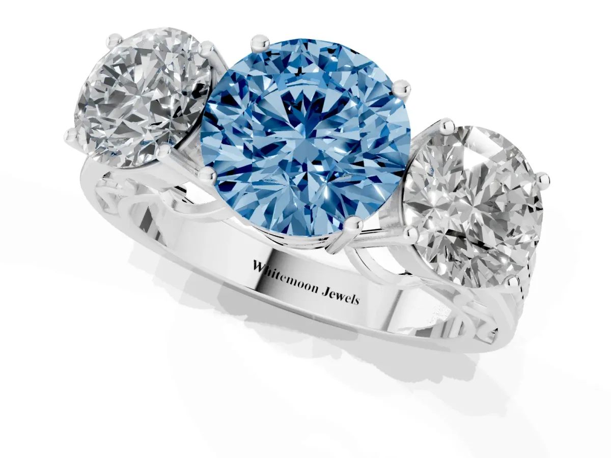 Fancy Blue Round Cut Diamond Three-Stone Ring with Prong Setting and Textured Band Platinum