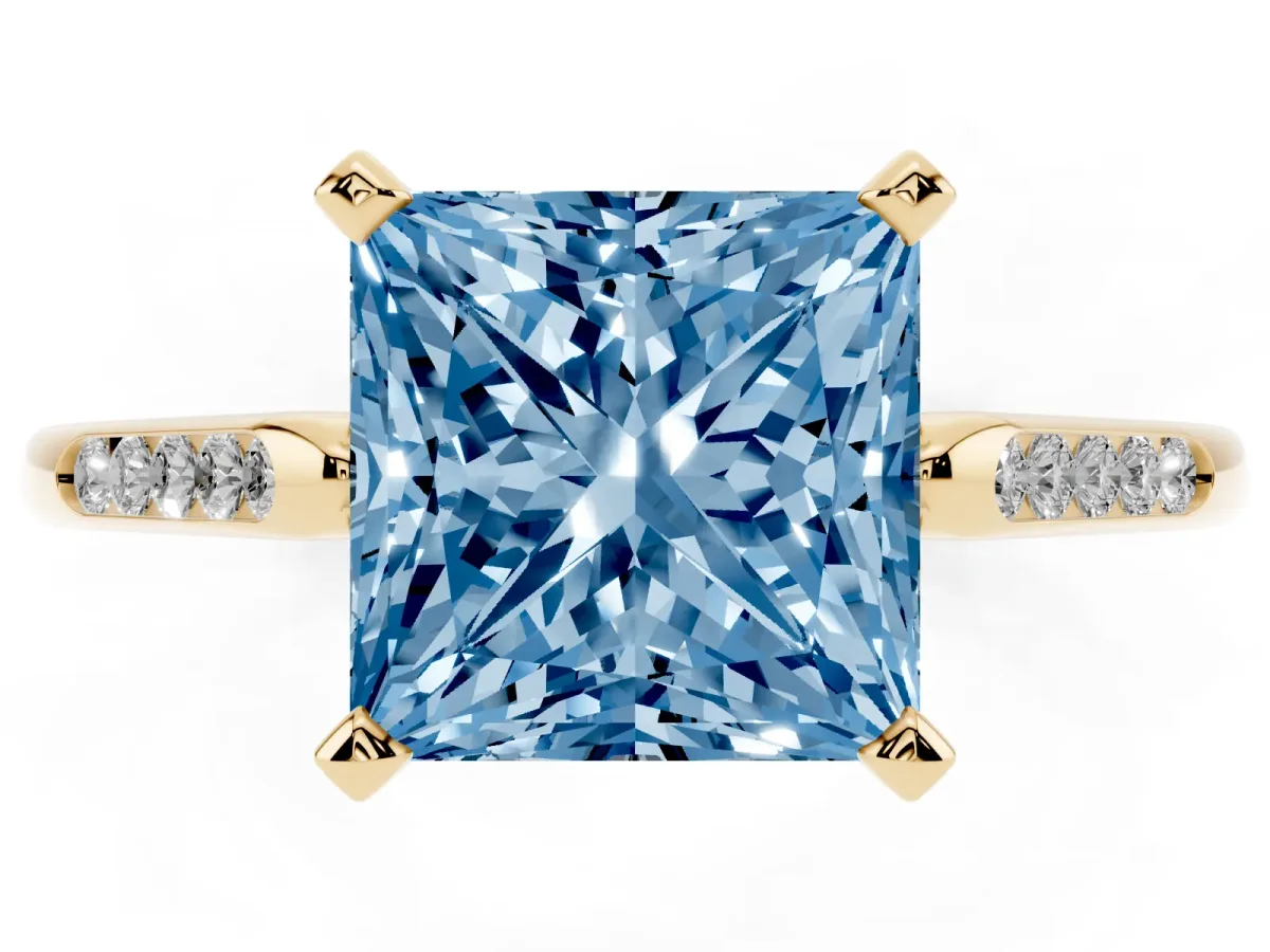 Fancy Blue Princess Cut Diamond Solitaire Ring with Channel Set Round Band and Prong Setting Yellow gold