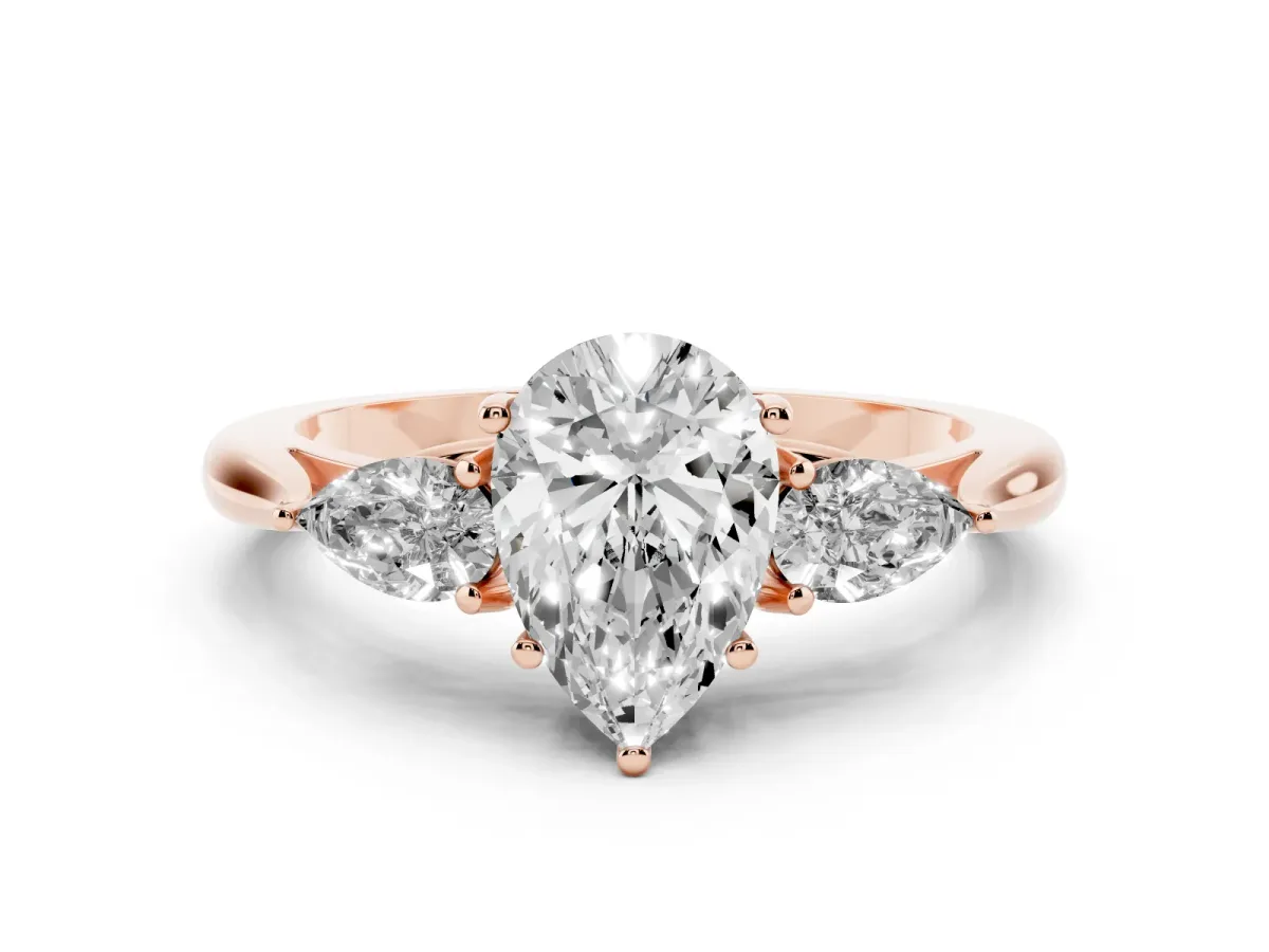Three-Stone Pear Cut Diamond Ring with Pear Side Stones in Four-Prong Setting Rose gold