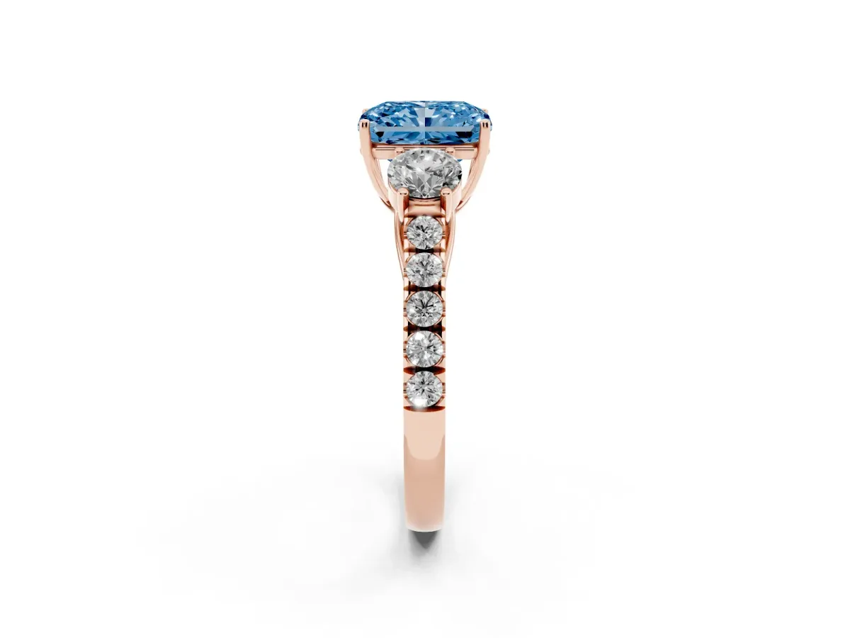 Fancy Blue Radiant Cut Cut Diamond Three-Stone Ring with Round Side Stones and Pavé Band Rose gold