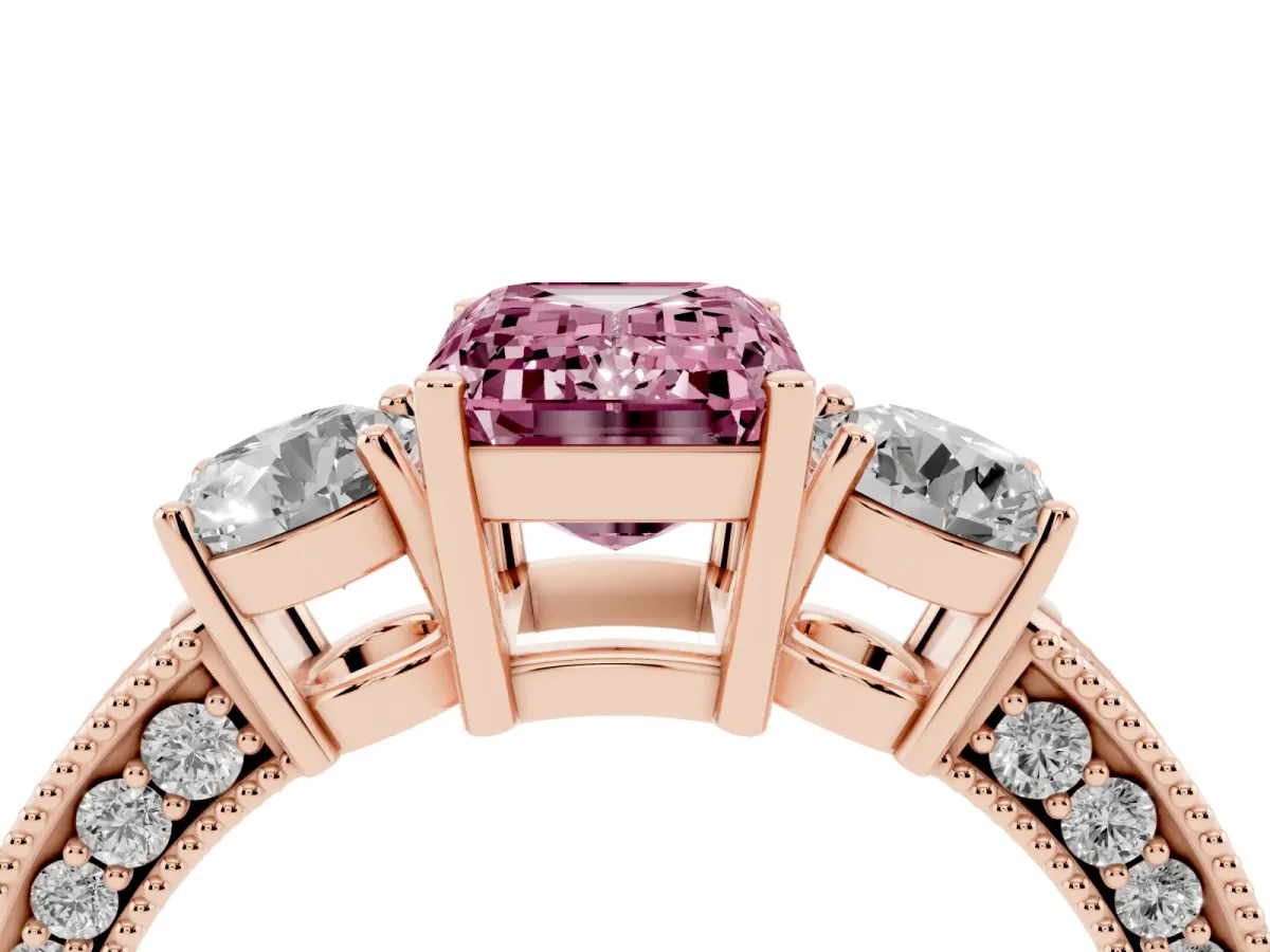 Fancy Pink Emerald Cut Three-Stone Diamond Ring with Pavé Band and Four-Prong Setting Rose gold