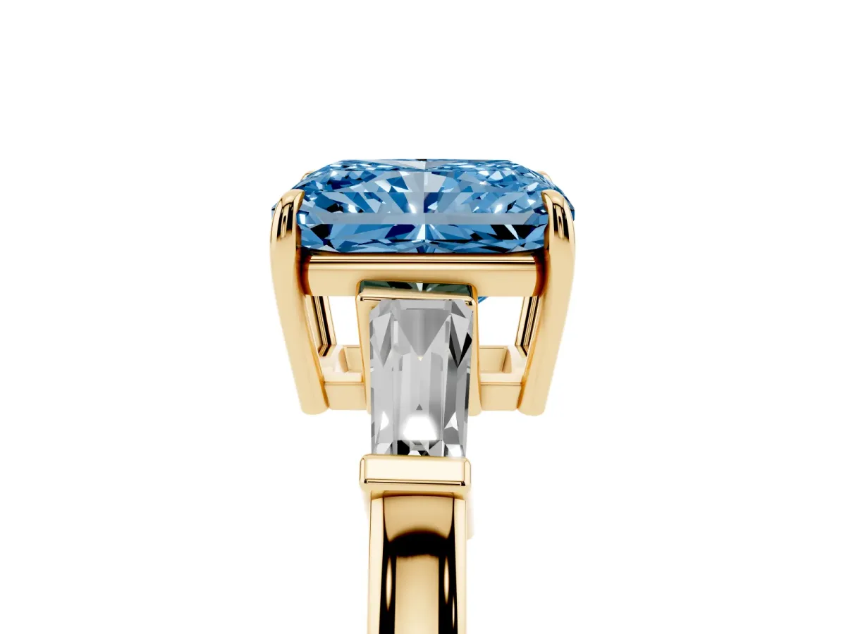 Fancy Blue Radiant Cut Diamond Three-Stone Ring with Tapered Baguette Side Stones and Prong Setting Yellow gold