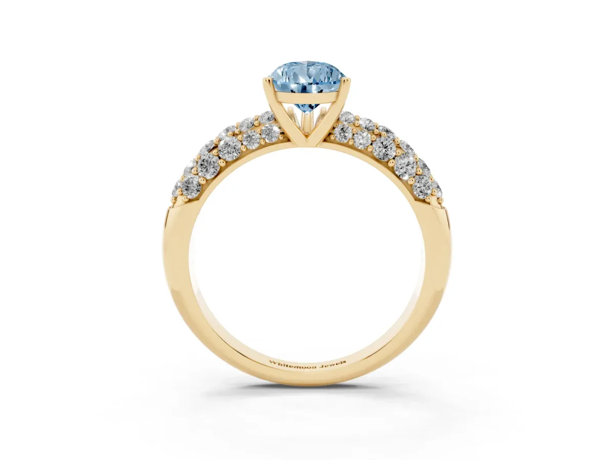 Fancy Blue Pear Cut Diamond Pavé Band Solitaire Ring with Four-Prong Setting Yellow gold
