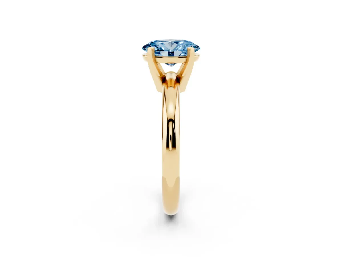 Fancy Blue Oval Cut Diamond Solitaire Engagement Ring with Round Band and Four-Prong Setting Yellow gold