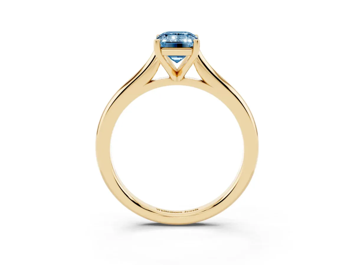 Fancy Blue Emerald Cut Cut Solitaire Ring with Cathedral Band and Four-Prong Setting Yellow gold