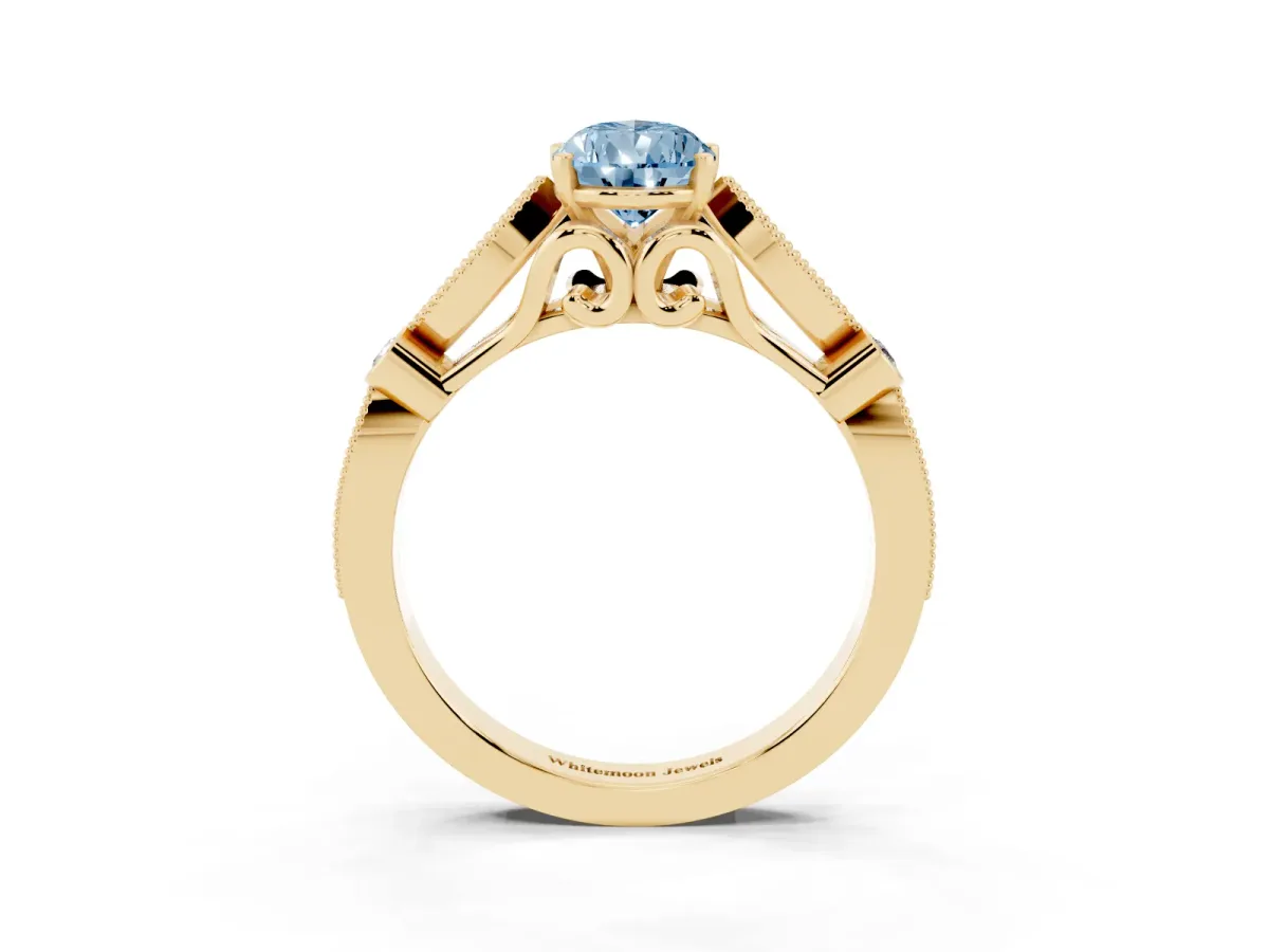 Fancy Blue Pear Cut Cut Diamond with Milgrain Marquise and Bezel Accents on a Solitaire Band with Prong Setting Yellow gold