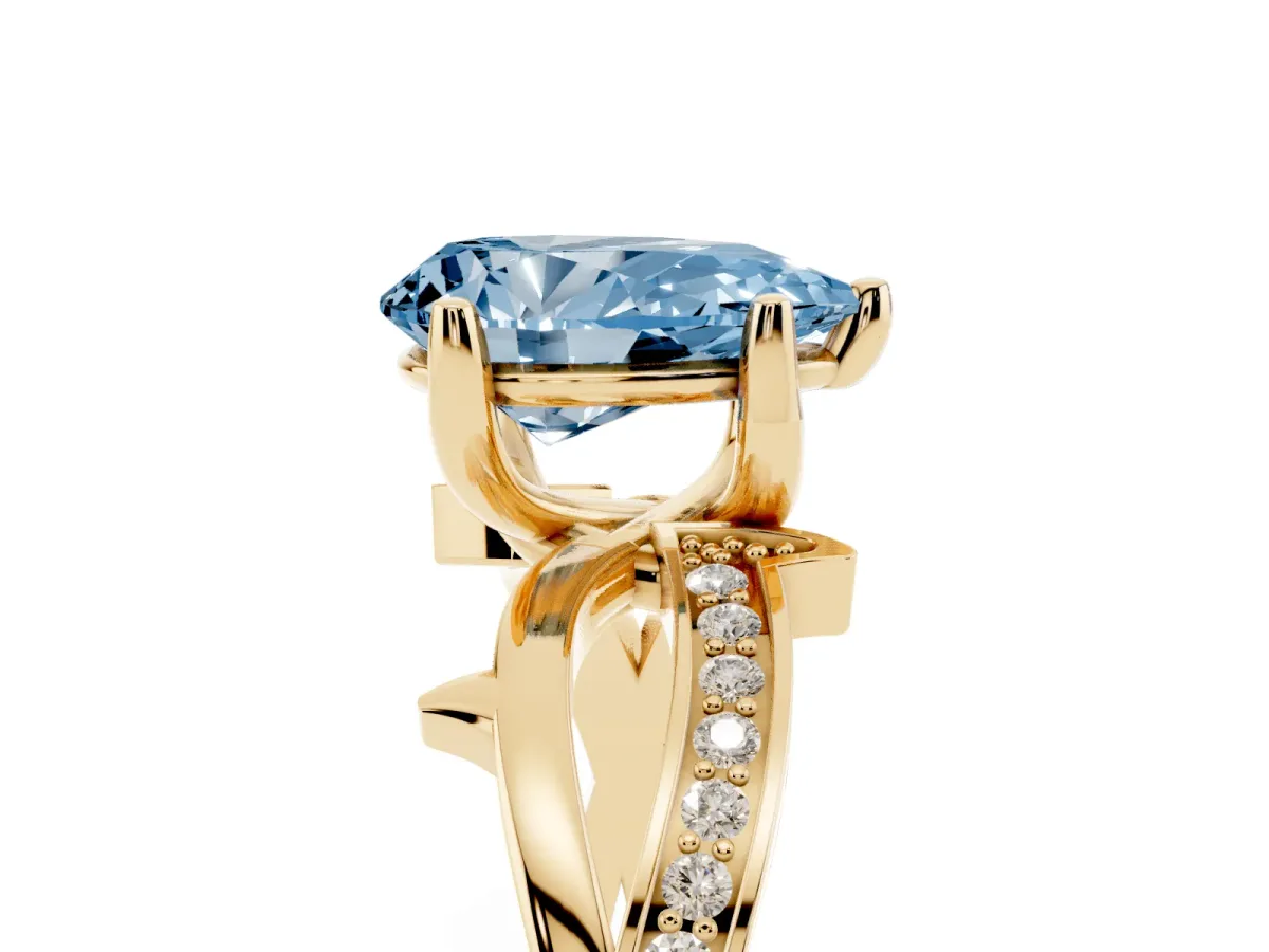 Fancy Blue Pear Cut Solitaire Twist Band with Pavé Accents and Four-Prong Setting Yellow gold
