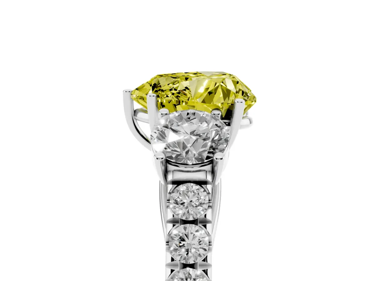 Fancy Yellow Heart Cut Cut Diamond Three-Stone Ring with Round Side Stones and Pavé Band Platinum