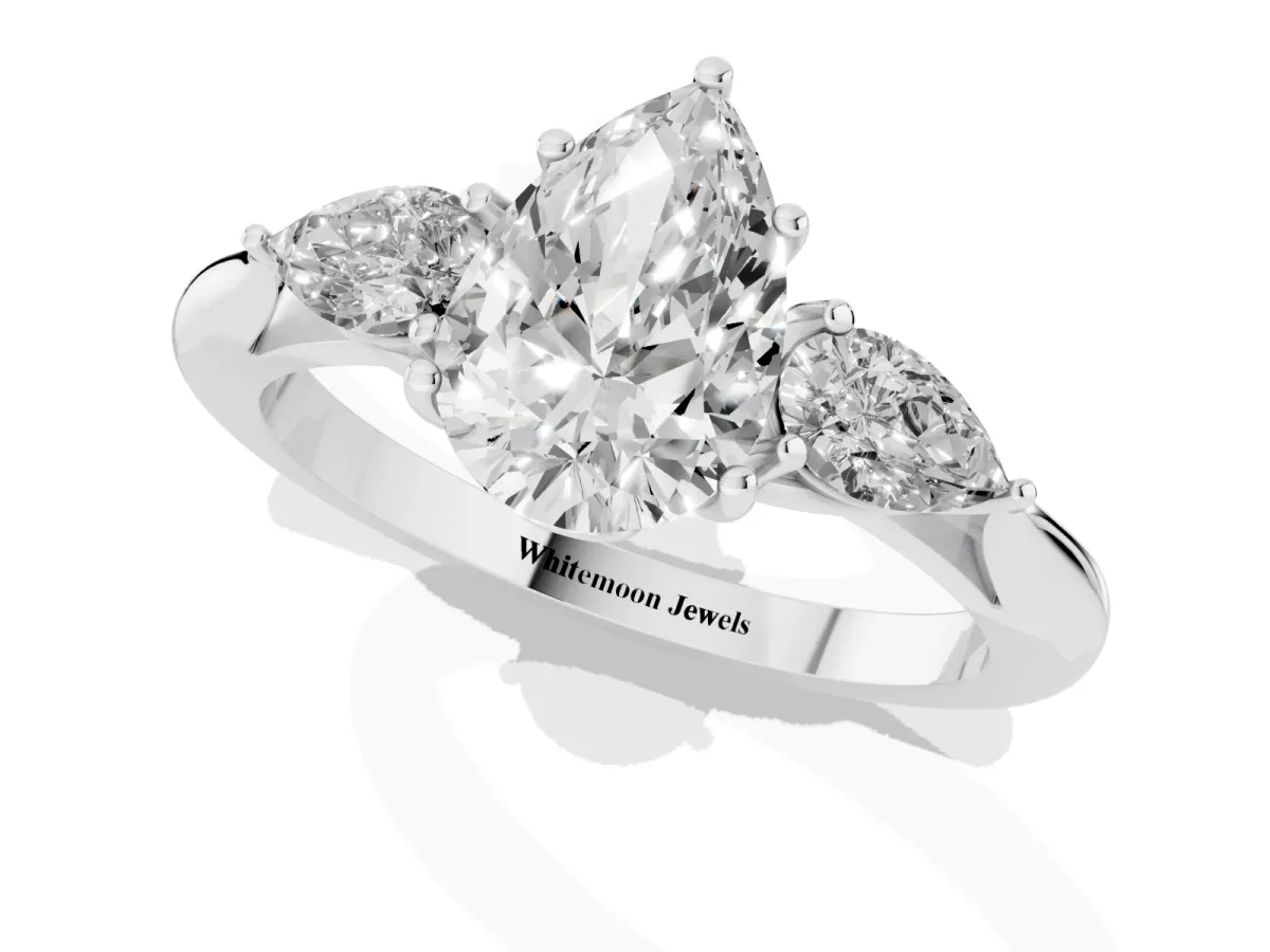 Three-Stone Pear Cut Brilliant Diamond Solitaire Ring with Tapered Band and Four-Prong Setting Platinum