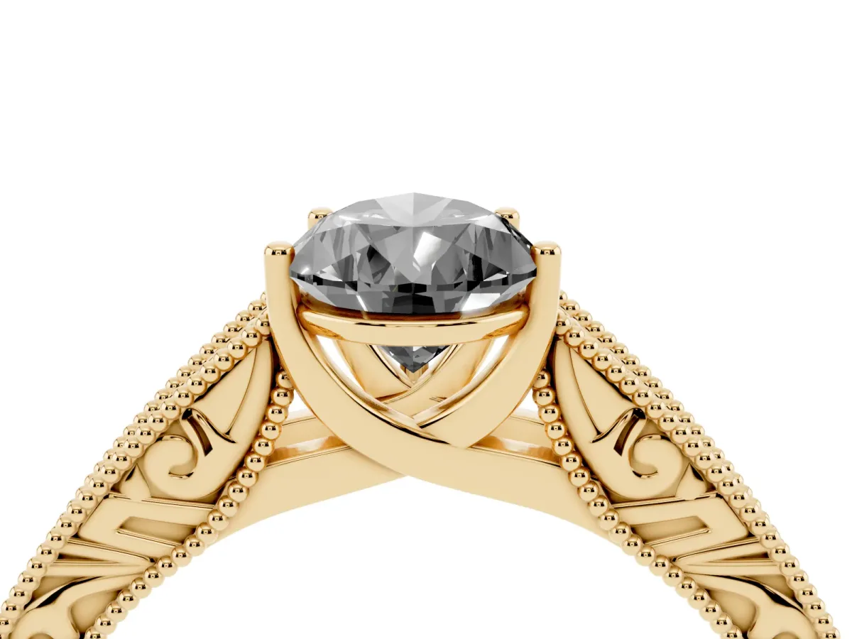 Fancy Black Pear Cut Diamond Solitaire Ring with Engraved Band and Four-Prong Setting Yellow gold