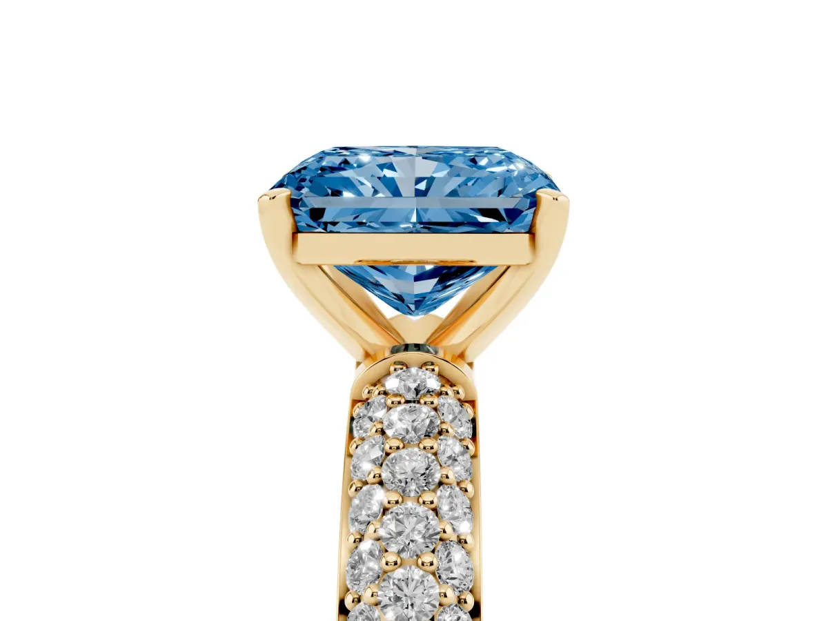 Fancy Blue Radiant Cut Diamond Solitaire Ring with Prong Setting and Pavé Band Yellow gold