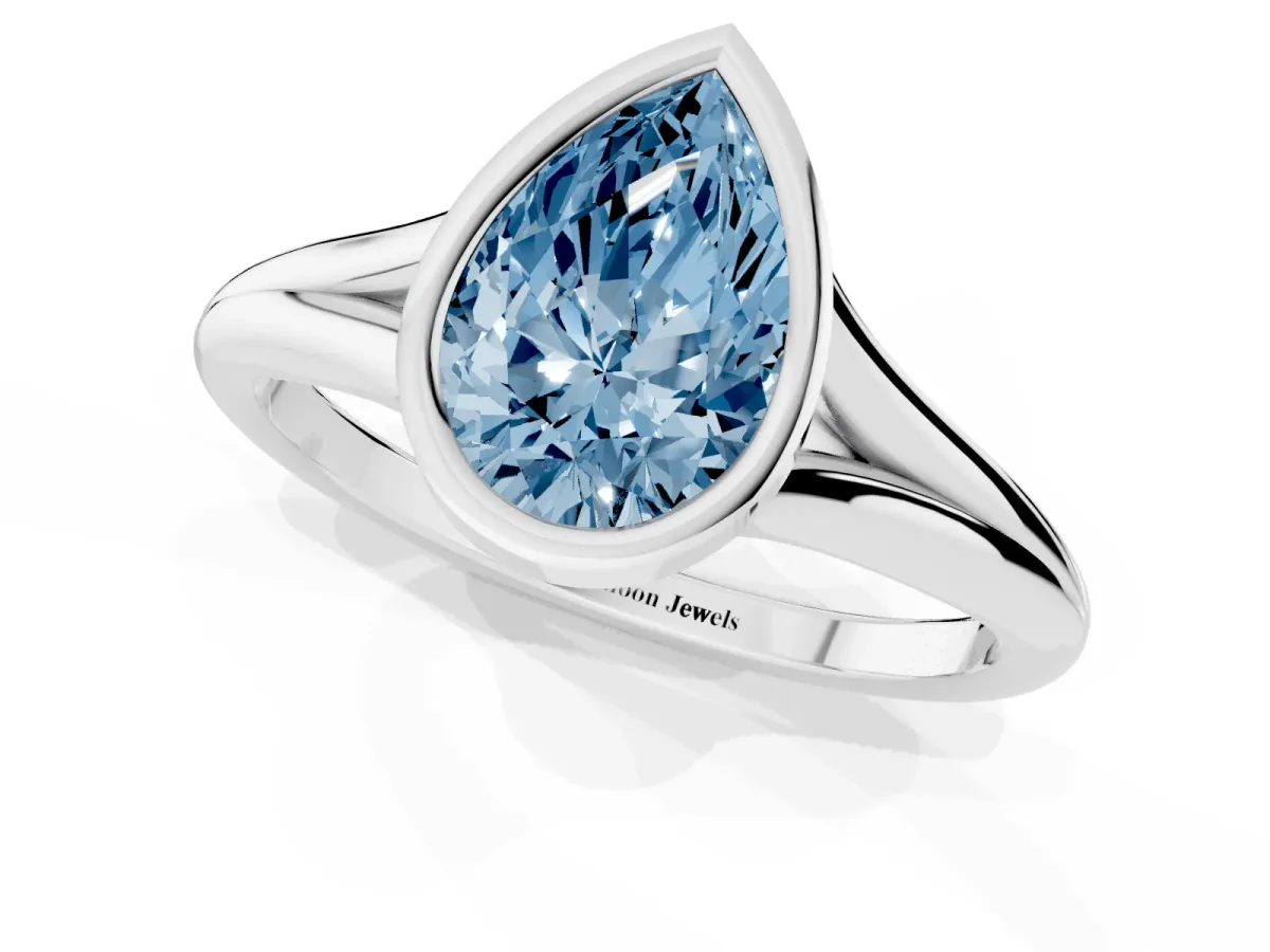 Fancy Blue Bezel Set Pear Cut Cut Solitaire Ring with Tapered Band Platinum