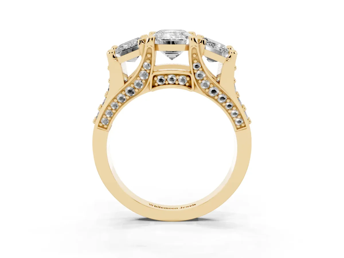 Emerald Cut Diamond Three-Stone Ring with Channel Set Band and Four-Prong Setting Yellow gold