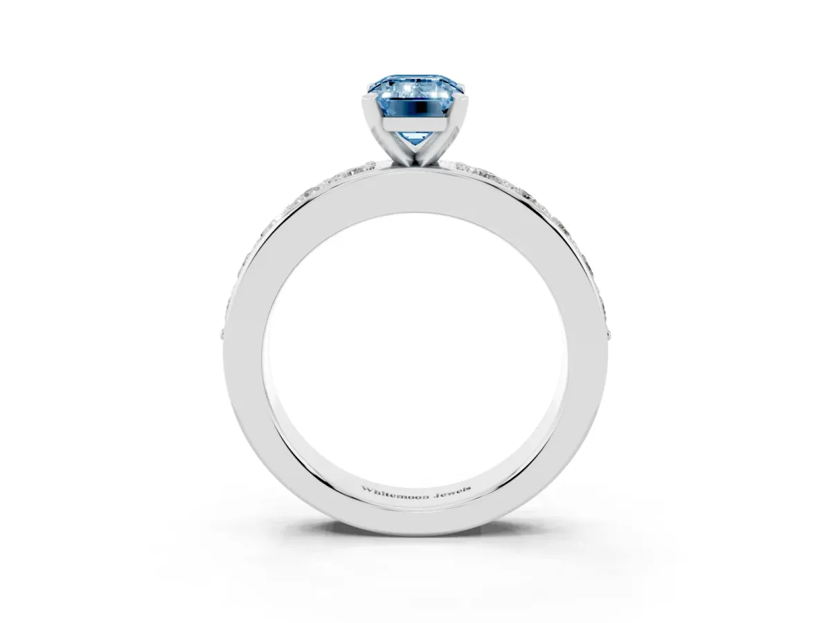Fancy Blue Emerald Cut Diamond Engagement Ring with Channel Set Round Band and Prong Setting Silver