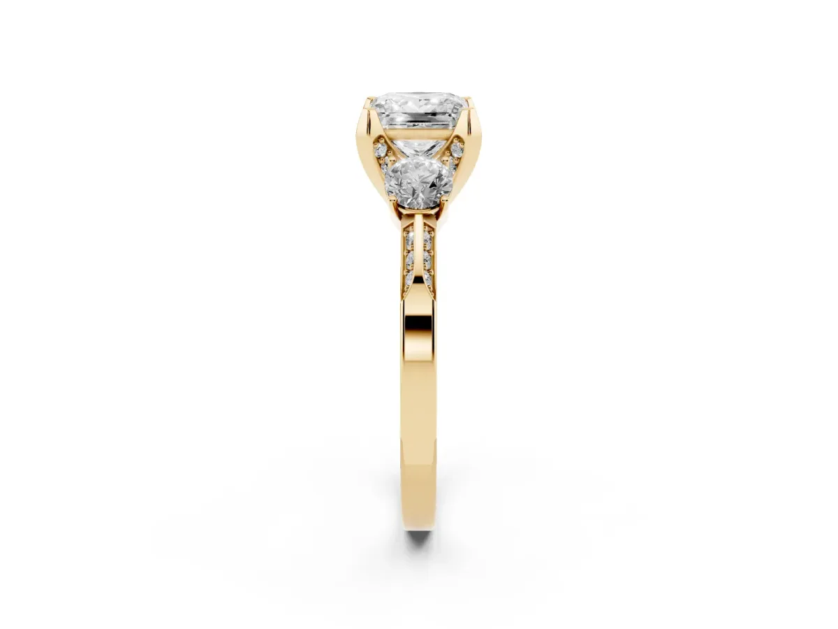 Princess Cut Brilliant Three-Stone Diamond Ring with Pavé Band and Four-Prong Setting Yellow gold