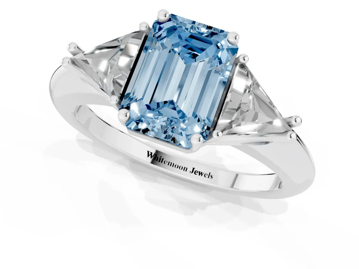 Fancy Blue Three-Stone Emerald Cut Diamond Engagement Ring with Trillion Side Stones and Prong Setting Silver