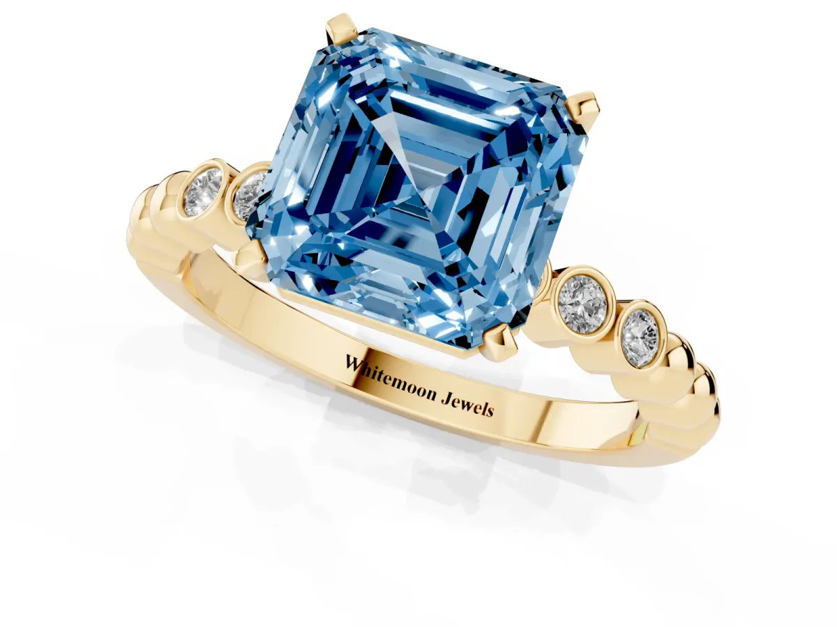 Fancy Blue Asscher Cut Solitaire Bezel Accent Diamond Engagement Ring with Beaded Band and Four-Prong Setting Yellow gold