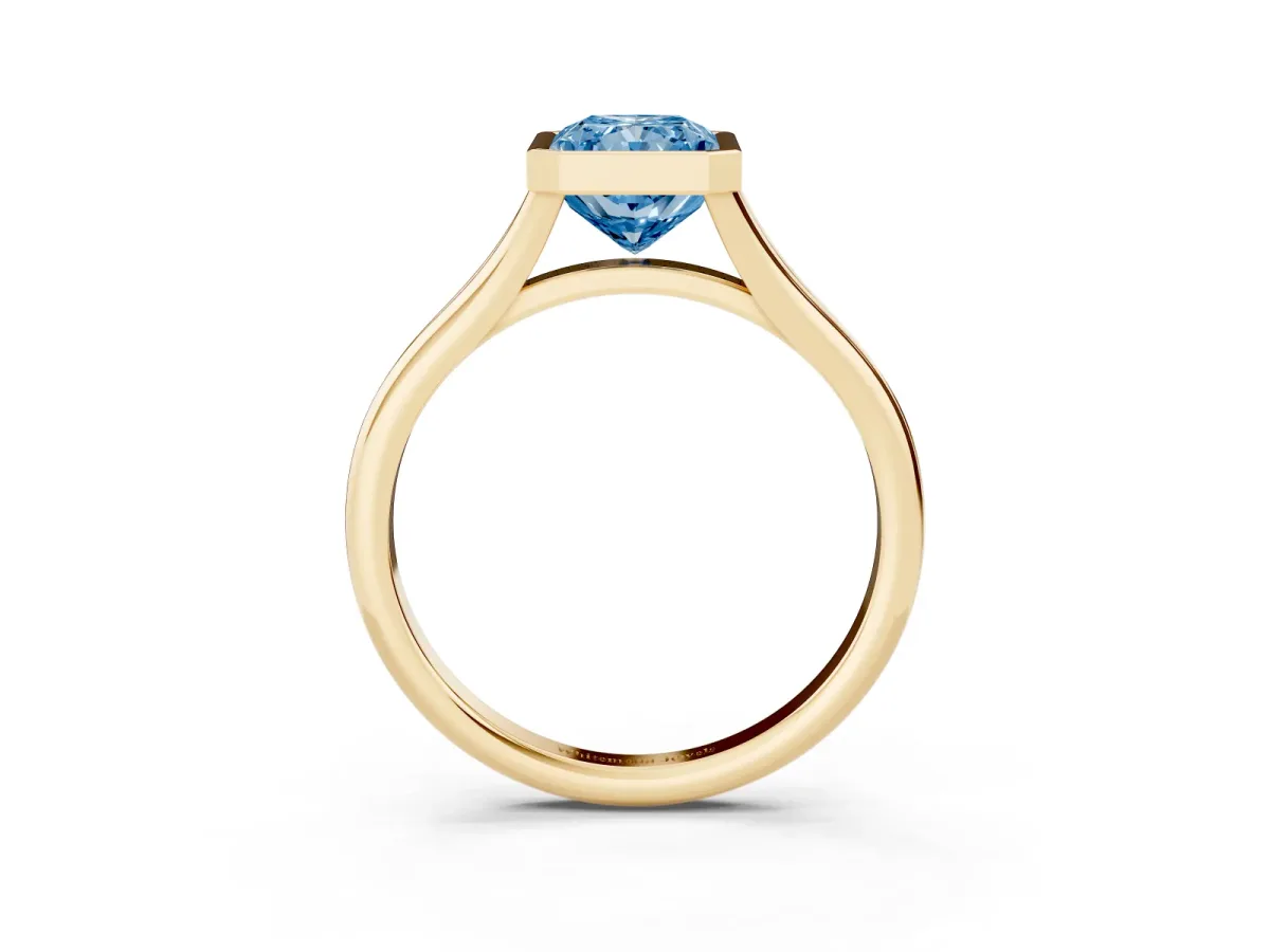 Fancy Blue Bezel Set Radiant Cut Cut Solitaire Ring with Tapered Band Yellow gold