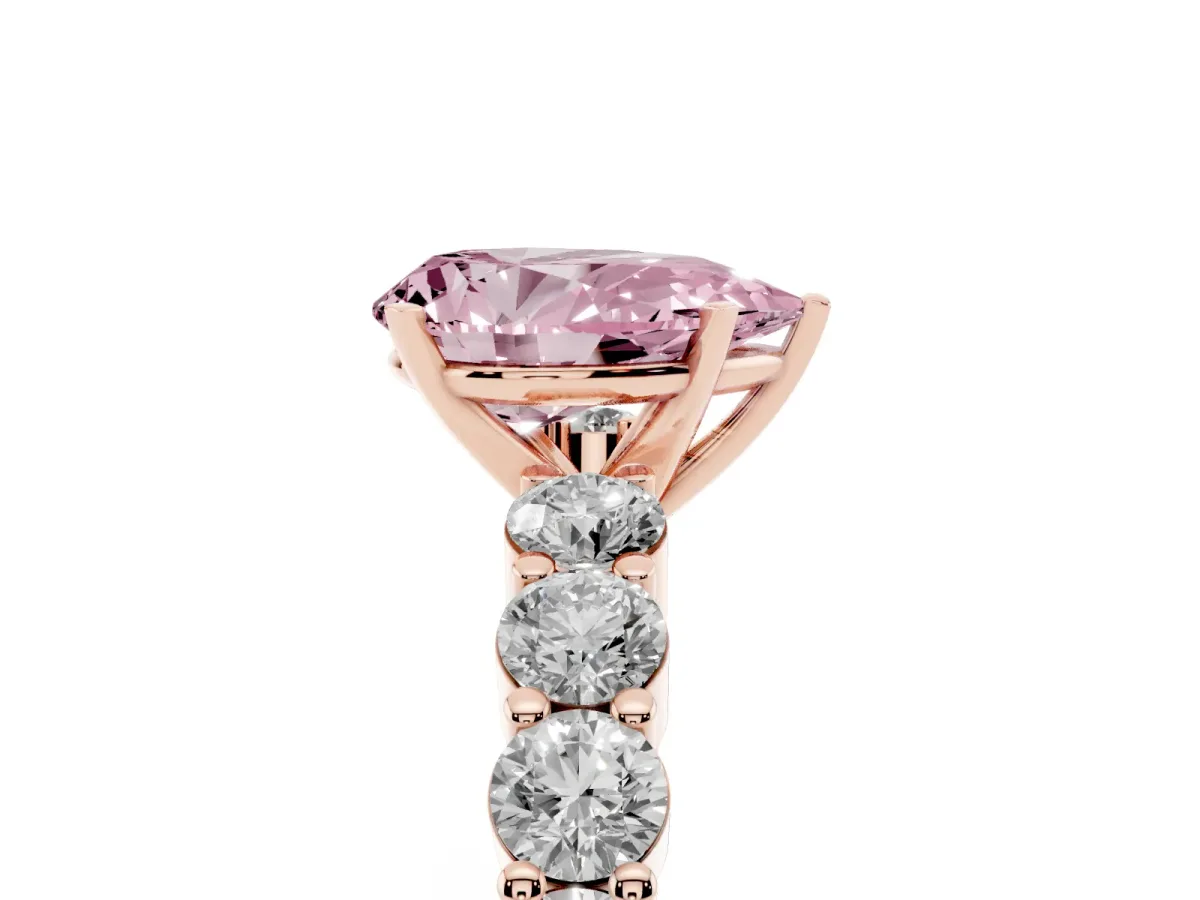 Fancy Pink Pear Cut Diamond Solitaire Ring with Shared Prong Round Side Stones Rose gold