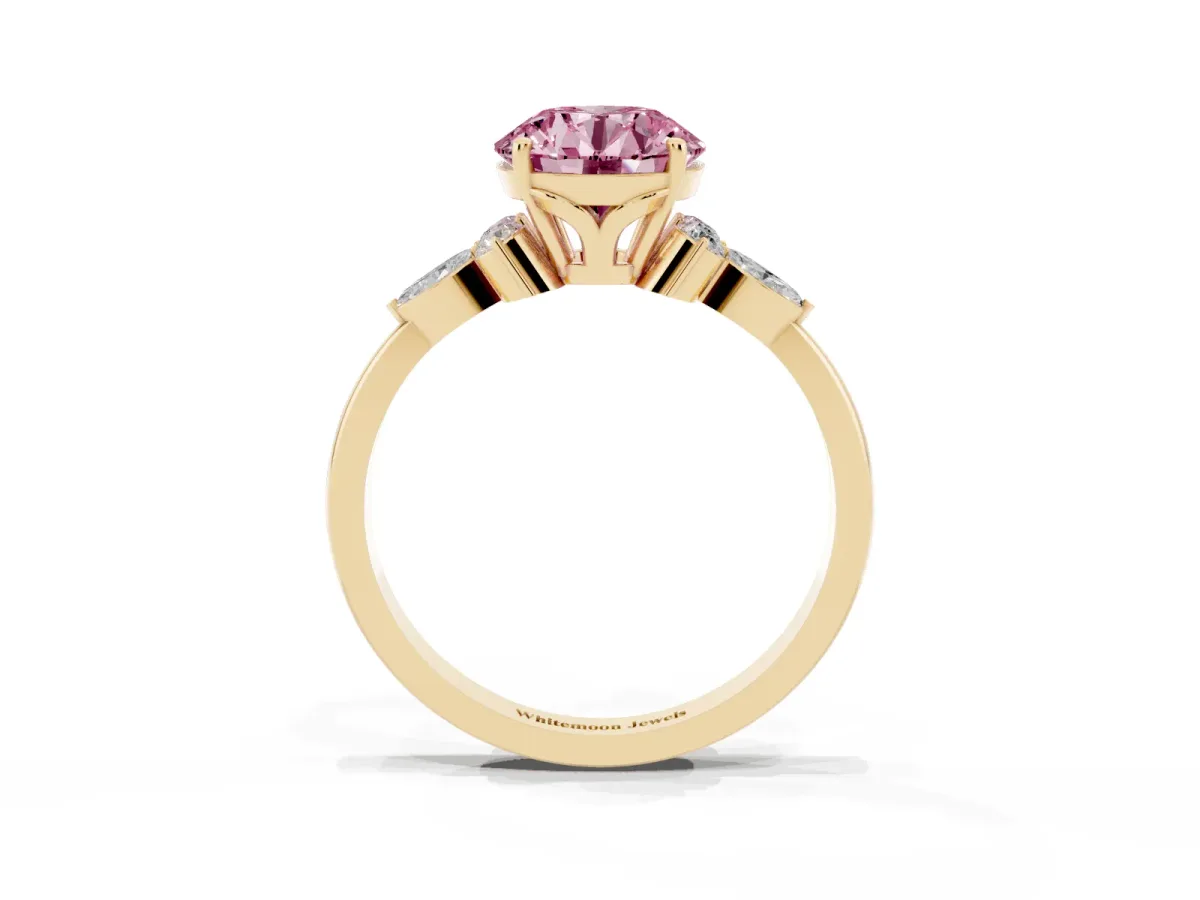 Fancy Pink Round Cut Brilliant Diamond Solitaire Ring with Pear Side Stones and Four-Prong Setting Yellow gold
