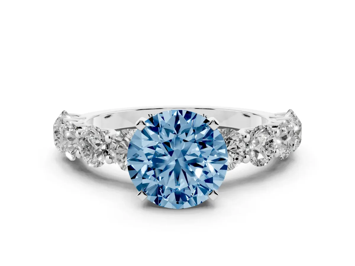 Fancy Blue Round Cut Diamond Prong Setting with Side Stones on a Pave Band Silver