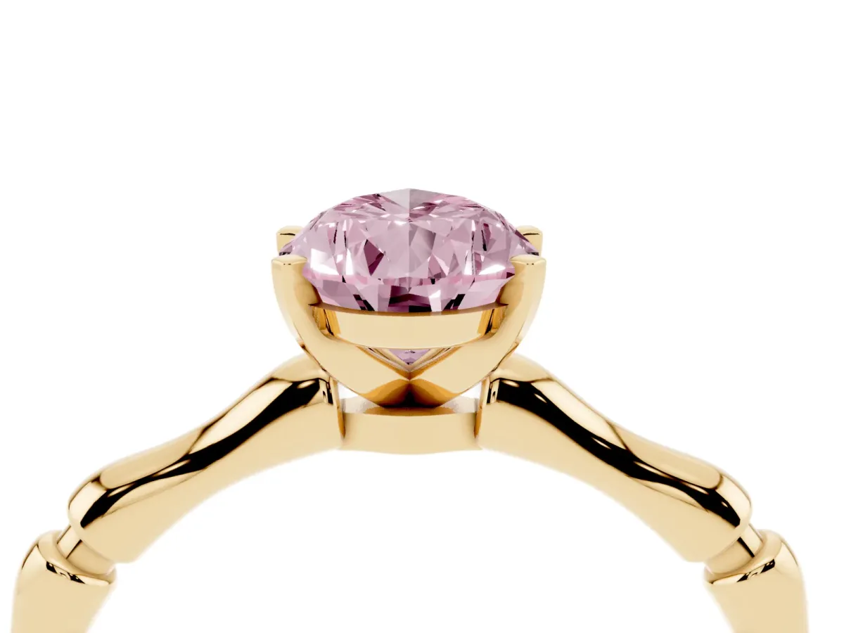 Fancy Pink Pear Cut Solitaire Diamond Ring with Bamboo Band and Four-Prong Setting Yellow gold