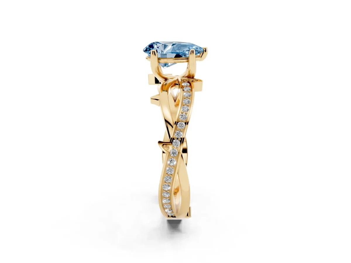 Fancy Blue Pear Cut Solitaire Twist Band with Pavé Accents and Four-Prong Setting Yellow gold