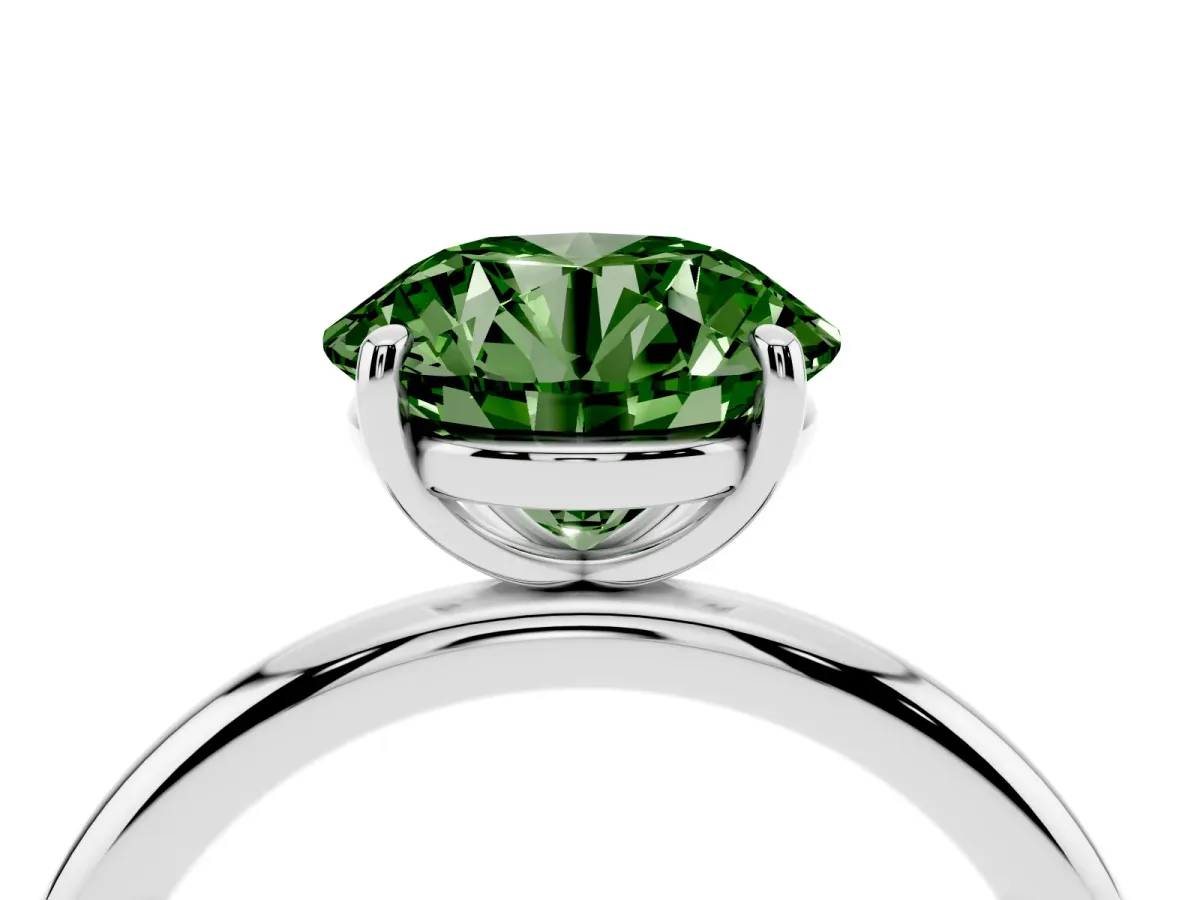 Fancy Green Round Cut Solitaire Diamond Ring with Four-Prong Setting on a Plain Band Platinum