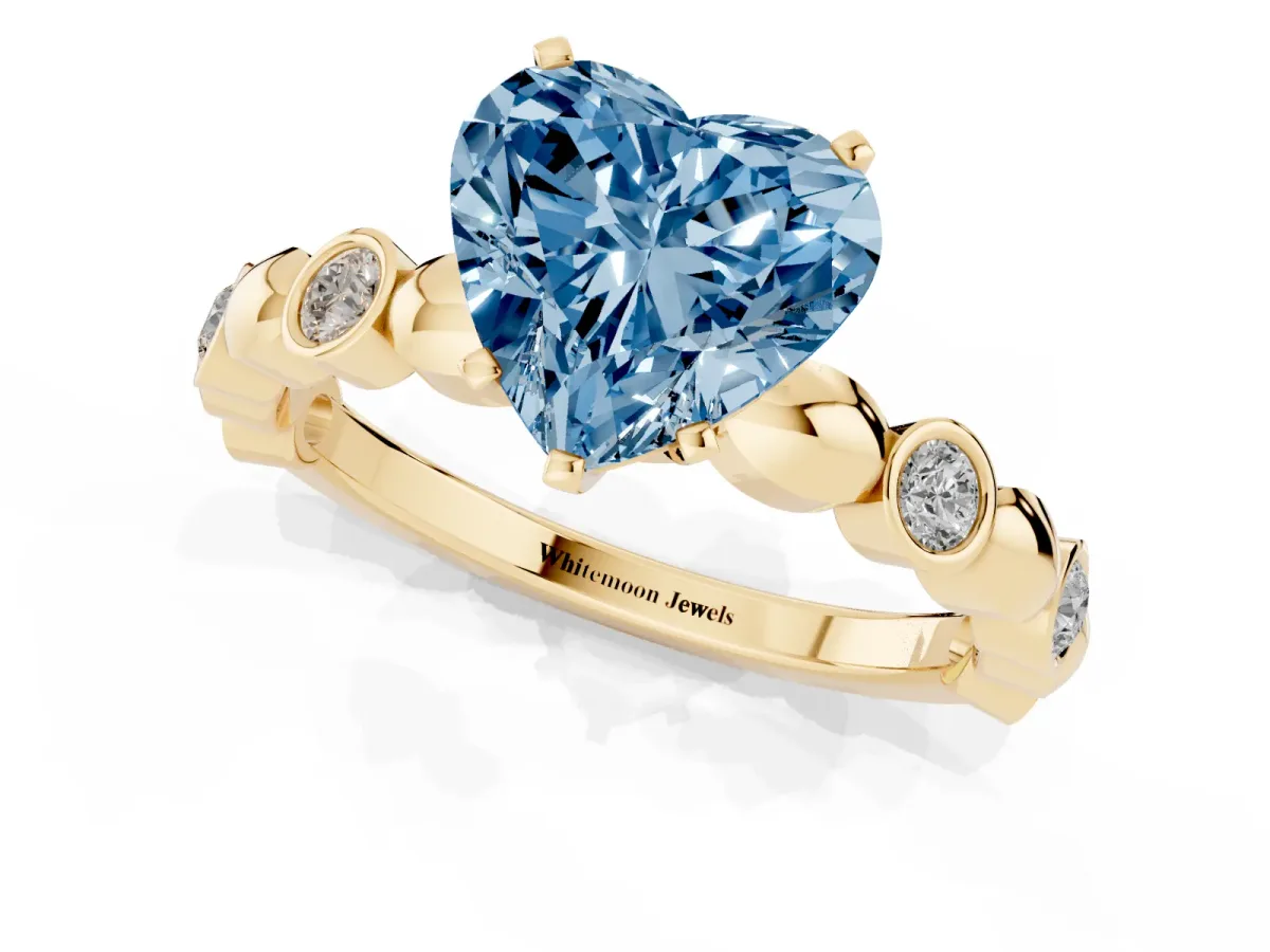Fancy Blue Heart Cut Solitaire Bezel-Set Diamond Ring with Beaded Band and Four-Prong Setting Yellow gold