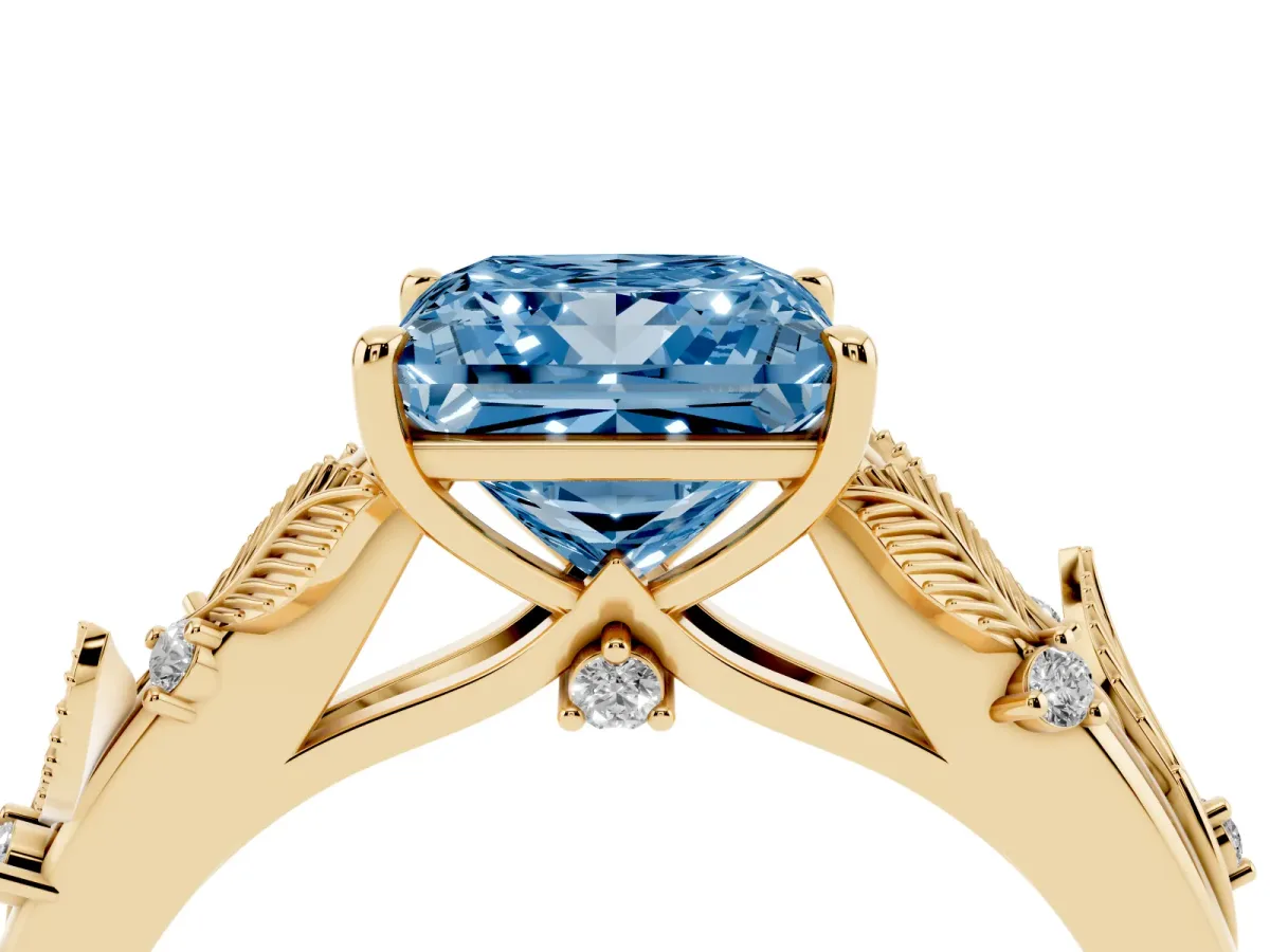 Fancy Blue Princess Cut Diamond Solitaire Ring with Leaf Motif Band and Four-Prong Setting Yellow gold