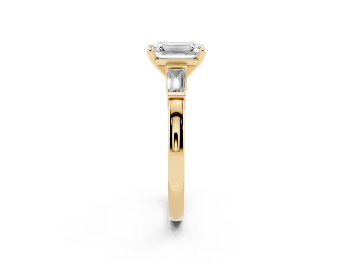Emerald Cut Cut Diamond Solitaire Ring with Tapered Baguette Accents and Four-Prong Setting Yellow gold