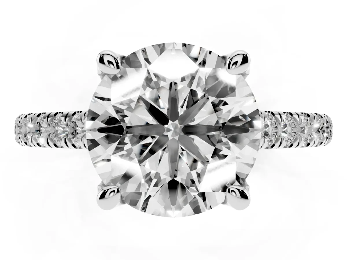 Round Cut Brilliant Diamond Solitaire with Pavé Band and Four-Prong Setting Silver