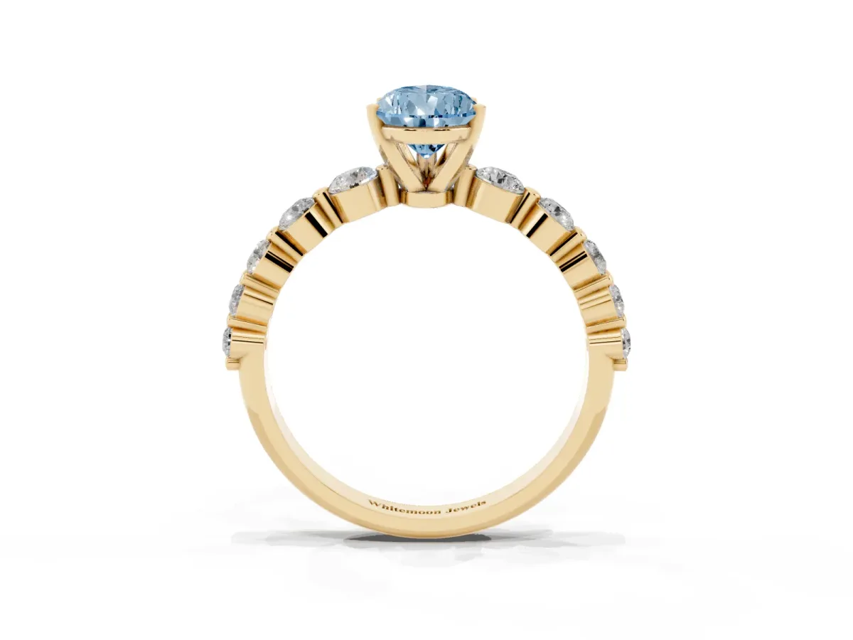 Fancy Blue Pear Cut Solitaire Diamond Ring with Pave Band and Four-Prong Setting Yellow gold