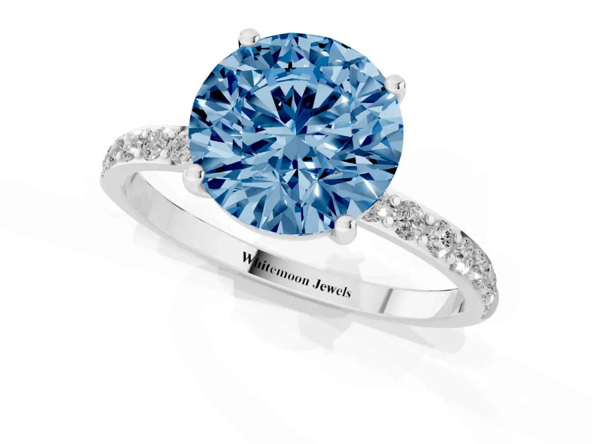 Fancy Blue Round Cut Diamond Solitaire Ring with Round Pavé Shoulders and Prong Setting Silver
