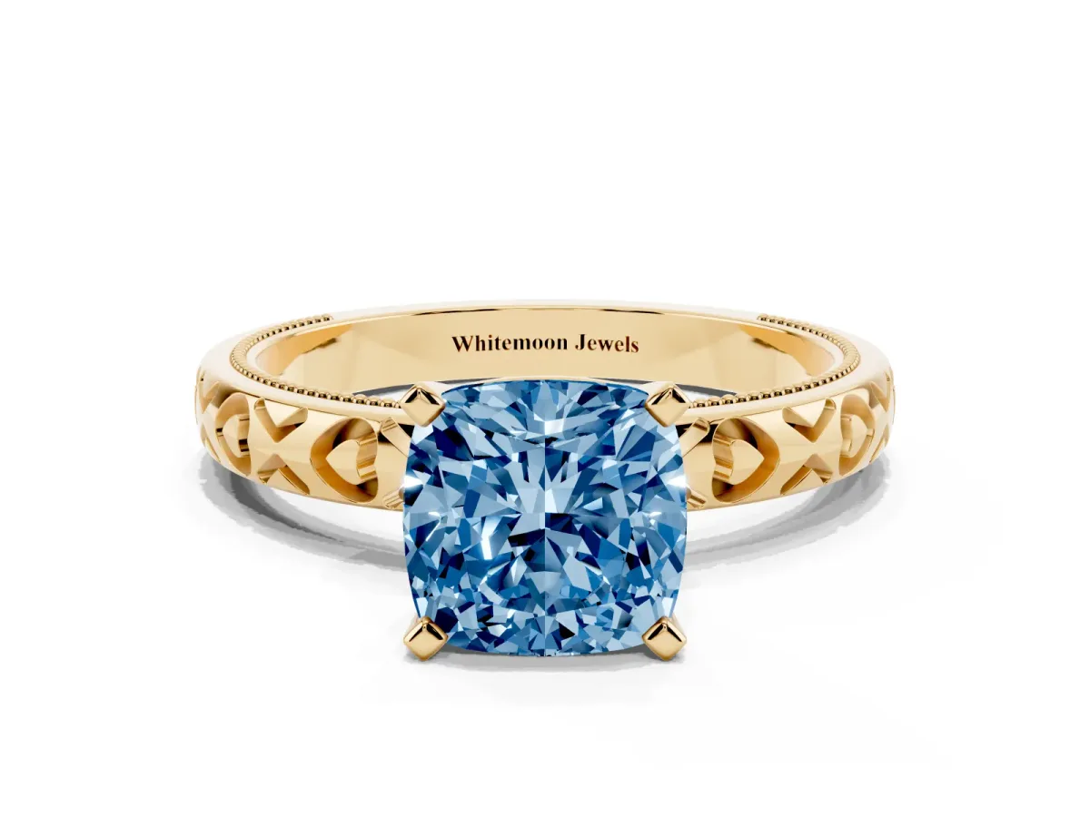 Fancy Blue Cushion Cut Solitaire Diamond Engagement Ring with XO Engraved Band and Four-Prong Setting Yellow gold