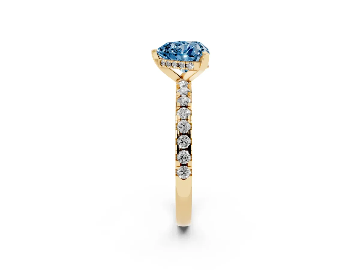 Fancy Blue Heart Cut Diamond Solitaire Ring with Round Pavé Band and Four-Prong Setting Yellow gold