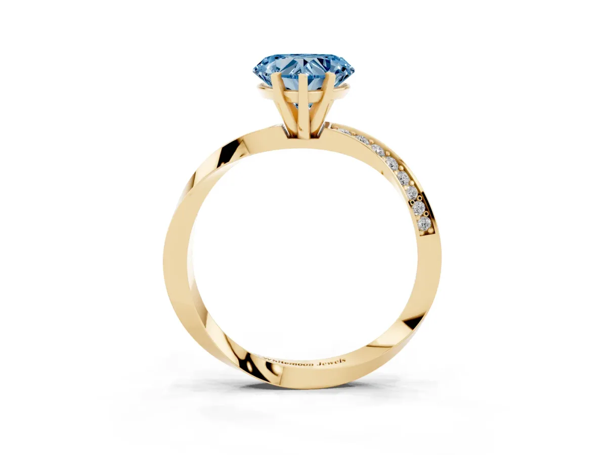 Fancy Blue Heart Cut Diamond Engagement Ring with Side Stone Accents and Four-Prong Setting Yellow gold